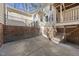 Backyard with brick retaining wall and an elevated deck with access to the house at 6301 King Lawrence Rd, Raleigh, NC 27607