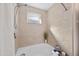 Bright, neutral bathroom showcasing a deep soaking tub and tiled shower with a rainfall showerhead at 6301 King Lawrence Rd, Raleigh, NC 27607