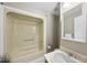 Bathroom featuring a tub-shower combination with a sink, mirror, and decorative plant in view at 6301 King Lawrence Rd, Raleigh, NC 27607