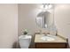 Powder room featuring a toilet, vanity with sink, and decor at 6301 King Lawrence Rd, Raleigh, NC 27607