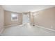 Bright bedroom with an ensuite bathroom, carpet, and natural light at 6301 King Lawrence Rd, Raleigh, NC 27607