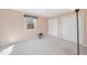 Neutral bedroom featuring a bright window, spacious closet, and neutral carpet at 6301 King Lawrence Rd, Raleigh, NC 27607