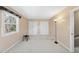 Simple bedroom with carpet, a bright window, and double closets for ample storage at 6301 King Lawrence Rd, Raleigh, NC 27607