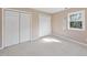 Bright bedroom with double closets and natural light, offering ample storage space at 6301 King Lawrence Rd, Raleigh, NC 27607