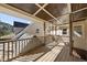 Spacious outdoor deck with wood railings and a decorative ceiling, perfect for entertaining at 6301 King Lawrence Rd, Raleigh, NC 27607