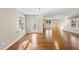 Bright dining area features hardwood floors, a modern chandelier, and ample natural light at 6301 King Lawrence Rd, Raleigh, NC 27607
