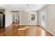 Open dining space with a chandelier, hardwood floors, and seamless flow to the kitchen at 6301 King Lawrence Rd, Raleigh, NC 27607