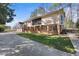 Expansive home featuring a wrap-around porch, brick foundation, and large driveway with plenty of parking for Gathering and friends at 6301 King Lawrence Rd, Raleigh, NC 27607