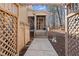 Charming front entrance framed by a decorative wooden gate and a landscaped walkway at 6301 King Lawrence Rd, Raleigh, NC 27607
