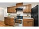 Efficient kitchen boasts stainless steel appliances, granite counters, and ample storage, ready for any chef at 6301 King Lawrence Rd, Raleigh, NC 27607