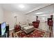 Finished basement boasts wood floors, sofa, recliners, TV, and dining set for versatile living at 6301 King Lawrence Rd, Raleigh, NC 27607