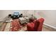 Basement living area with an accent rug, multiple sofas, and a TV for cozy entertainment at 6301 King Lawrence Rd, Raleigh, NC 27607