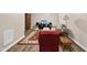 Basement living area with accent rug, sofa, and a TV for entertainment at 6301 King Lawrence Rd, Raleigh, NC 27607