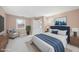 Comfortable main bedroom with a large bed, seating area, and an ensuite bathroom at 6301 King Lawrence Rd, Raleigh, NC 27607