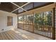 Relaxing screened porch providing views of the home's backyard at 6301 King Lawrence Rd, Raleigh, NC 27607