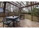 Backyard features a wooden deck with an outdoor table set and a covered pergola at 6913 Baywood Dr, Raleigh, NC 27613