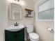 Small bathroom with updated fixtures, decorated with a funny wall hanging at 6913 Baywood Dr, Raleigh, NC 27613