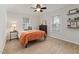 Bedroom with neutral walls, carpet, and a bright window at 6913 Baywood Dr, Raleigh, NC 27613