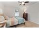 Cozy bedroom with neutral walls, ceiling fan, and a window for natural light at 6913 Baywood Dr, Raleigh, NC 27613