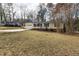 One-story home with a front porch and garage, with bare trees surrounding the property at 6913 Baywood Dr, Raleigh, NC 27613