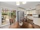 Bright kitchen area features stainless steel appliances and a door to a deck for outdoor dining at 6913 Baywood Dr, Raleigh, NC 27613