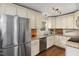 Updated kitchen featuring stainless steel appliances, granite countertops, and plenty of cabinet storage at 6913 Baywood Dr, Raleigh, NC 27613