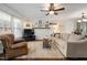 Living room featuring hardwood flooring, a ceiling fan, and lots of natural light at 6913 Baywood Dr, Raleigh, NC 27613