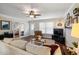 Cozy living room featuring neutral paint, ceiling fan, and hardwood floors at 6913 Baywood Dr, Raleigh, NC 27613