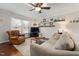 Living room featuring hardwood flooring, a ceiling fan, and neutral wall paint at 6913 Baywood Dr, Raleigh, NC 27613