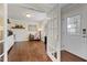 Office/Den area featuring hardwood floors, built in cabinets, and white trim throughout at 6913 Baywood Dr, Raleigh, NC 27613
