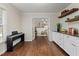 View of the office through an interior door, with hardwood flooring and adjacent living space at 6913 Baywood Dr, Raleigh, NC 27613