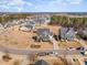 An aerial view of a two-story house with a well-manicured lawn in a suburban neighborhood on a sunny day at 710 Legacy Falls S S Dr, Chapel Hill, NC 27517