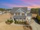 An aerial view of a two-story home with an attached garage and mature landscaping at 710 Legacy Falls S S Dr, Chapel Hill, NC 27517