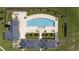 Aerial view of the community pool with lounge seating and manicured lawns at 710 Legacy Falls S S Dr, Chapel Hill, NC 27517