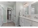 Bathroom with dual sinks, a walk-in shower, and a walk-in closet at 710 Legacy Falls S S Dr, Chapel Hill, NC 27517