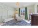 Bedroom featuring a crib, armchair, and decorative wallpaper and accents at 710 Legacy Falls S S Dr, Chapel Hill, NC 27517