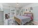 Bright bedroom featuring stylish decor, a comfortable bed, and natural light streaming through the window at 710 Legacy Falls S S Dr, Chapel Hill, NC 27517