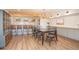 Open concept dining room boasts a wet bar, modern chandelier, and seating for six guests at 710 Legacy Falls S S Dr, Chapel Hill, NC 27517