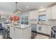 Open kitchen with an island, stainless steel appliances, and a seamless transition to outdoor spaces at 710 Legacy Falls S S Dr, Chapel Hill, NC 27517