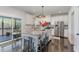 Modern kitchen featuring white cabinets, stainless steel appliances, and an island with bar seating at 710 Legacy Falls S S Dr, Chapel Hill, NC 27517