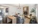 Cozy living room with a stone fireplace, chandelier and stylish decor at 710 Legacy Falls S S Dr, Chapel Hill, NC 27517