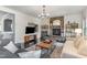 Cozy living room featuring a stone fireplace, hardwood floors, and comfortable seating at 710 Legacy Falls S S Dr, Chapel Hill, NC 27517