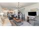 Open concept living room and staircase with great natural light and hardwood floors at 710 Legacy Falls S S Dr, Chapel Hill, NC 27517