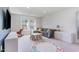 Playroom featuring a comfortable gray couch, ABC carpet, and a large window at 710 Legacy Falls S S Dr, Chapel Hill, NC 27517