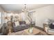 Open-concept living area featuring hardwood floors, stairs and a seamless flow to the kitchen at 710 Legacy Falls S S Dr, Chapel Hill, NC 27517