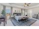 Airy main bedroom features a tray ceiling, seating area, and plenty of natural light at 710 Legacy Falls S S Dr, Chapel Hill, NC 27517