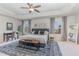 Spacious main bedroom with tray ceiling, sitting area, and large windows for natural light at 710 Legacy Falls S S Dr, Chapel Hill, NC 27517