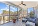 Relaxing sunroom with screened windows, comfortable seating, and views of the surrounding nature at 710 Legacy Falls S S Dr, Chapel Hill, NC 27517