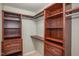 Custom walk-in closet with built-in shelving, drawers, and plenty of storage space at 710 Legacy Falls S S Dr, Chapel Hill, NC 27517