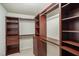 Custom walk-in closet with built-in shelving, drawers, and ample hanging space at 710 Legacy Falls S S Dr, Chapel Hill, NC 27517